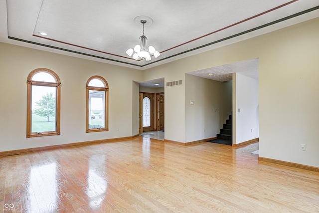 7333 State Road 42, Martinsville, IN 46151 - unfurnished room with stairway, a chandelier, light wood-style floors, baseboards, and recessed lighting