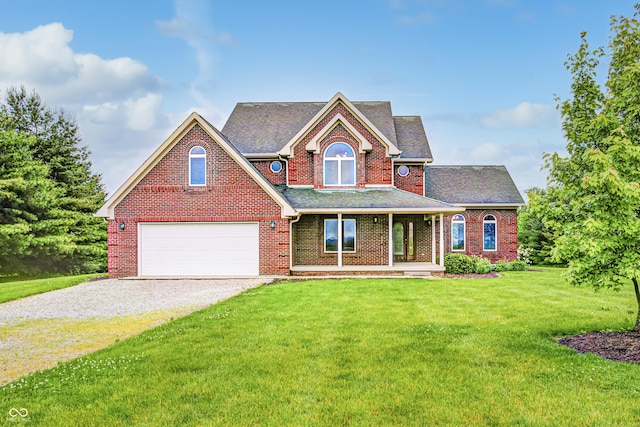 7333 State Road 42, Martinsville, IN 46151 - traditional-style home featuring a garage, driveway, covered porch, brick siding, and a front yard