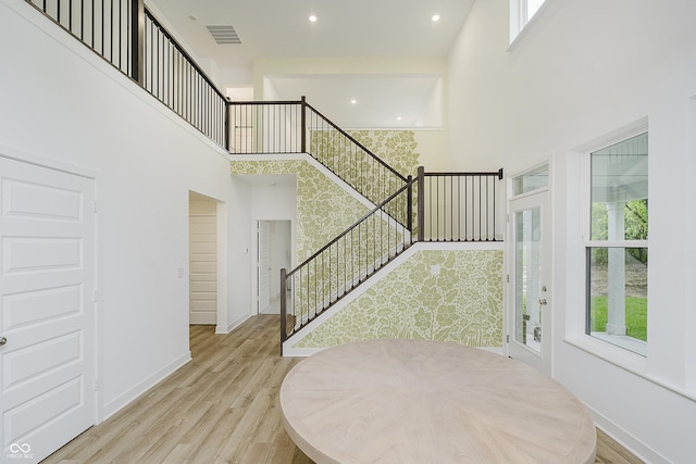 1510 Stonehaven Dr, Westfield, IN 46074 - staircase featuring a towering ceiling, wood finished floors, baseboards, and recessed lighting