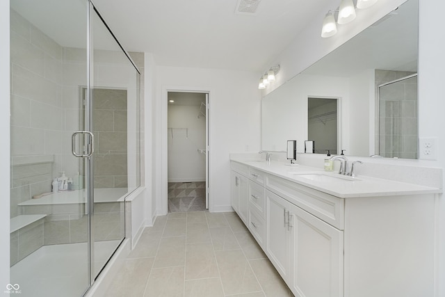 1510 Stonehaven Dr, Westfield, IN 46074 - full bath with a walk in closet, double vanity, a shower stall, and tile patterned floors