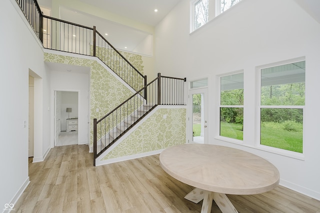 1510 Stonehaven Dr, Westfield, IN 46074 - staircase with a high ceiling, baseboards, and wood finished floors