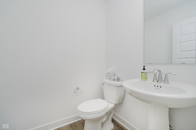 1510 Stonehaven Dr, Westfield, IN 46074 - bathroom featuring wood finished floors, baseboards, and toilet