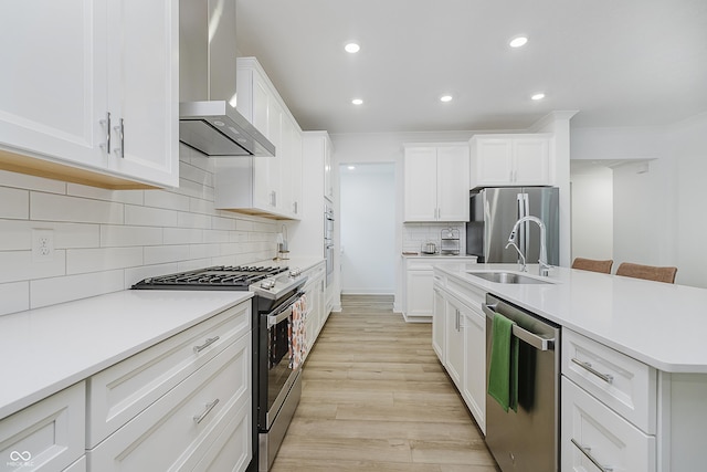 1510 Stonehaven Dr, Westfield, IN 46074 - kitchen with stainless steel appliances, wall chimney range hood, a sink, recessed lighting, and backsplash