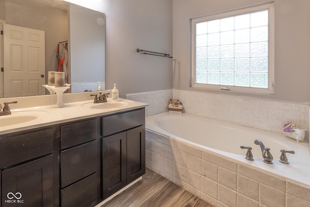 121 George Ct, Danville, IN 46122 - full bathroom featuring a bath, double vanity, and wood finished floors