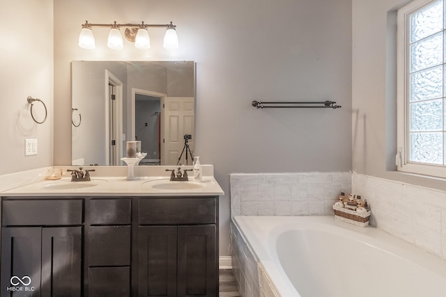 121 George Ct, Danville, IN 46122 - bathroom with double vanity and a garden tub