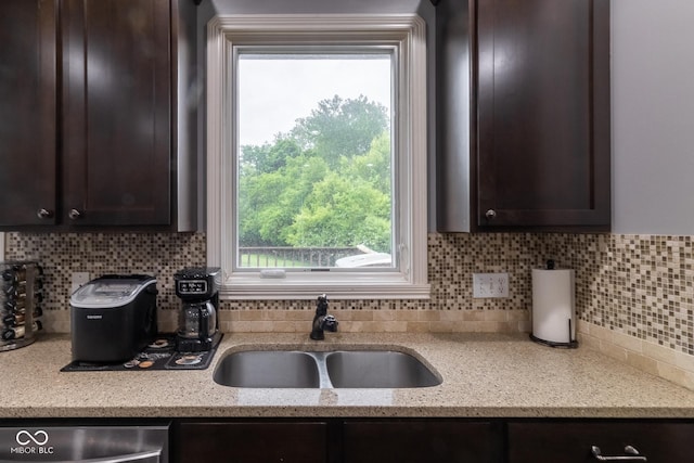 121 George Ct, Danville, IN 46122 - kitchen with dark brown cabinetry, decorative backsplash, a sink, and dishwasher