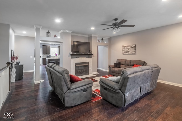 121 George Ct, Danville, IN 46122 - living area with dark wood-type flooring, ceiling fan, baseboards, a tiled fireplace, and recessed lighting