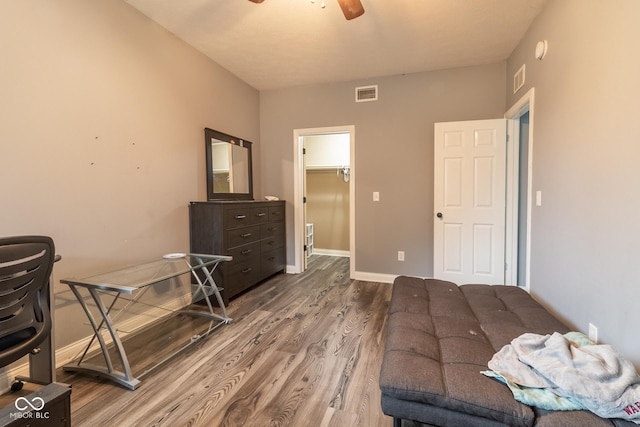 121 George Ct, Danville, IN 46122 - bedroom featuring wood finished floors, a walk in closet, and baseboards