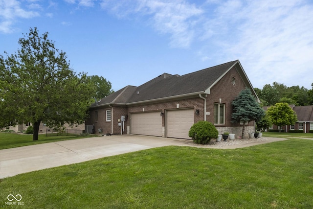 121 George Ct, Danville, IN 46122 - view of home's exterior featuring brick siding, an attached garage, concrete driveway, a lawn, and cooling unit
