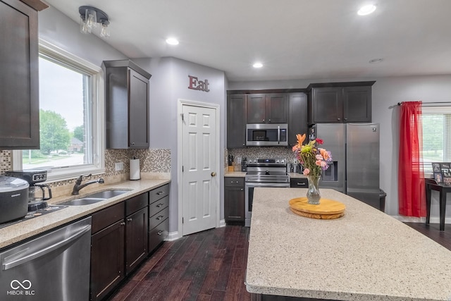 121 George Ct, Danville, IN 46122 - kitchen with appliances with stainless steel finishes, dark wood-style floors, a center island, a sink, and recessed lighting