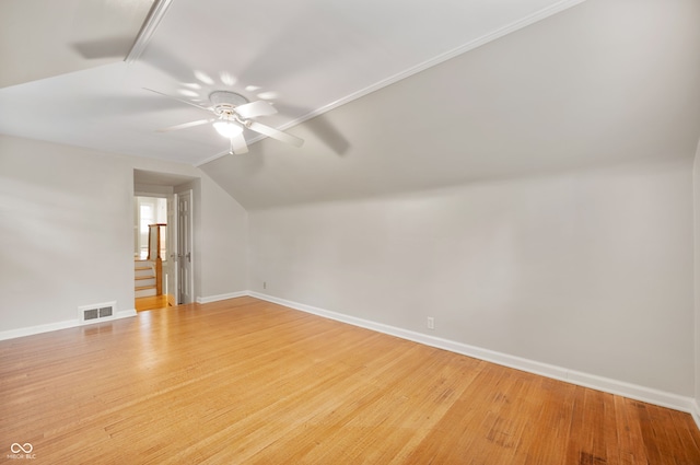 6020 Gladden Dr, Indianapolis, IN 46220 - additional living space featuring a ceiling fan, baseboards, light wood-style flooring, and vaulted ceiling