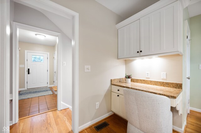 6020 Gladden Dr, Indianapolis, IN 46220 - laundry room with light wood-style floors and baseboards