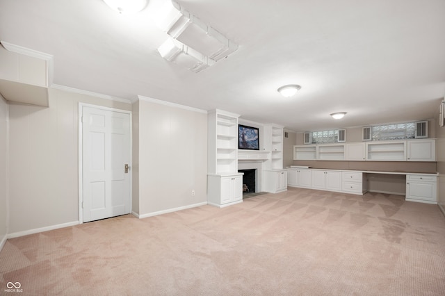 6020 Gladden Dr, Indianapolis, IN 46220 - below grade area featuring light carpet, crown molding, a fireplace, and baseboards