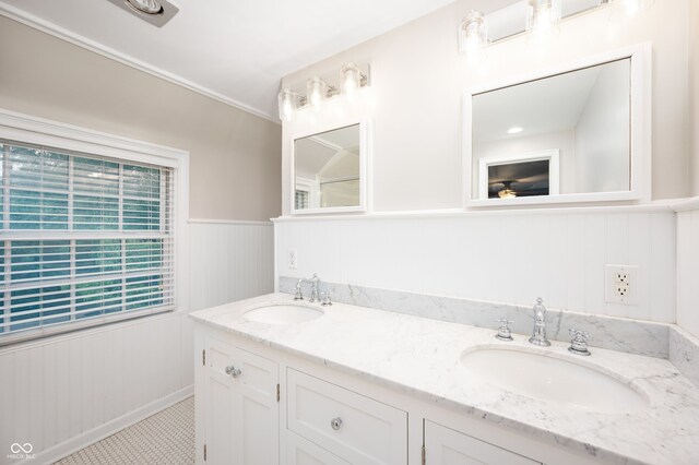 6020 Gladden Dr, Indianapolis, IN 46220 - bathroom featuring double vanity and a wainscoted wall