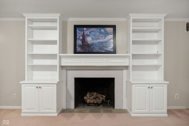 6020 Gladden Dr, Indianapolis, IN 46220 - unfurnished living room with light colored carpet, baseboards, a fireplace with flush hearth, crown molding, and built in features