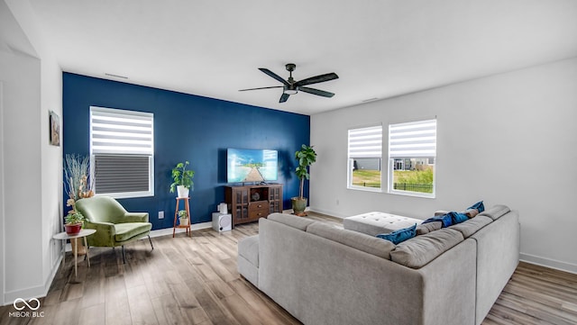 7226 Sayers Rd, Indianapolis, IN 46259 - living area featuring wood finished floors, ceiling fan, and baseboards