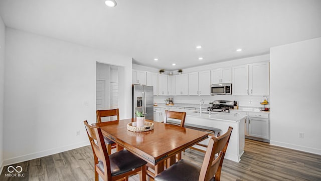 7226 Sayers Rd, Indianapolis, IN 46259 - dining room featuring wood finished floors, recessed lighting, and baseboards