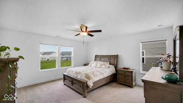 7226 Sayers Rd, Indianapolis, IN 46259 - bedroom with light carpet, baseboards, and ceiling fan