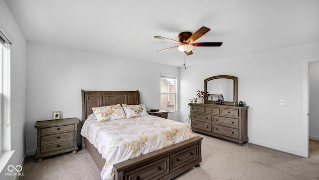 7226 Sayers Rd, Indianapolis, IN 46259 - bedroom with light carpet, a ceiling fan, and baseboards