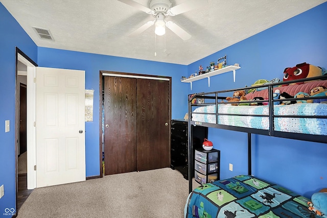 200 Forum Dr, Whiteland, IN 46184 - carpeted bedroom featuring a closet, ceiling fan, and a textured ceiling