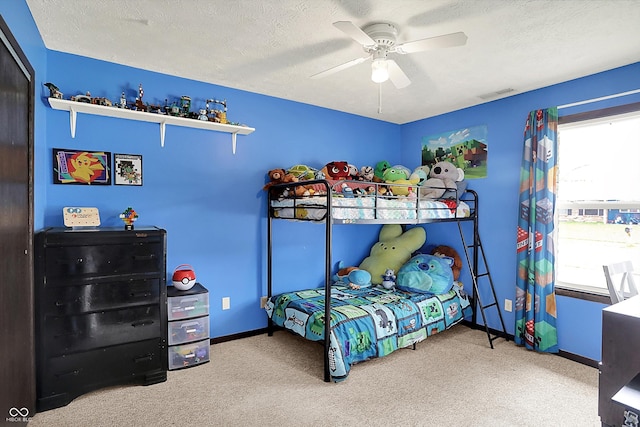 200 Forum Dr, Whiteland, IN 46184 - bedroom with carpet, baseboards, a textured ceiling, and ceiling fan