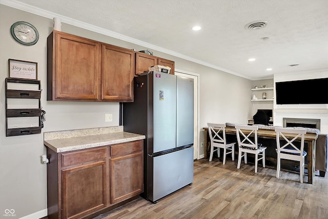 200 Forum Dr, Whiteland, IN 46184 - kitchen with freestanding refrigerator, light wood-style floors, light countertops, baseboards, and recessed lighting