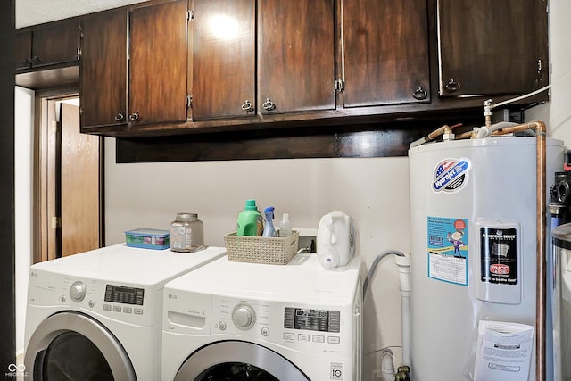 200 Forum Dr, Whiteland, IN 46184 - laundry area with electric water heater, washer and dryer, and cabinet space