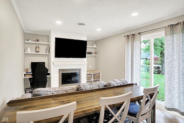 200 Forum Dr, Whiteland, IN 46184 - dining room featuring ornamental molding, wood finished floors, a fireplace, and recessed lighting