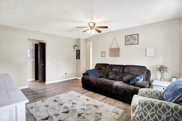200 Forum Dr, Whiteland, IN 46184 - living room with ceiling fan, wood finished floors, baseboards, and a textured ceiling