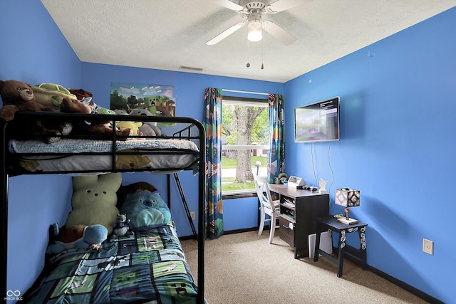 200 Forum Dr, Whiteland, IN 46184 - carpeted bedroom featuring a textured ceiling, baseboards, and ceiling fan