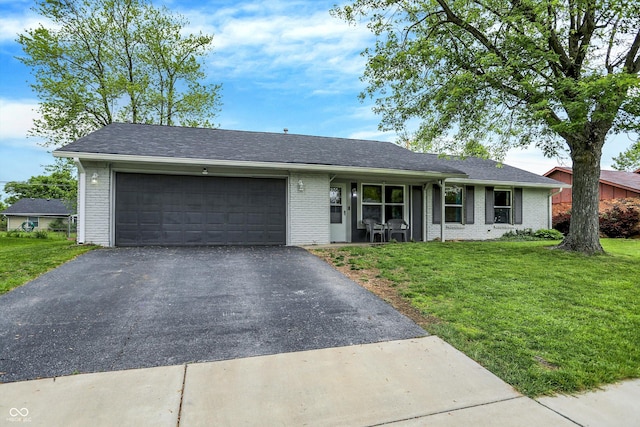 200 Forum Dr, Whiteland, IN 46184 - single story home with driveway, brick siding, and a garage
