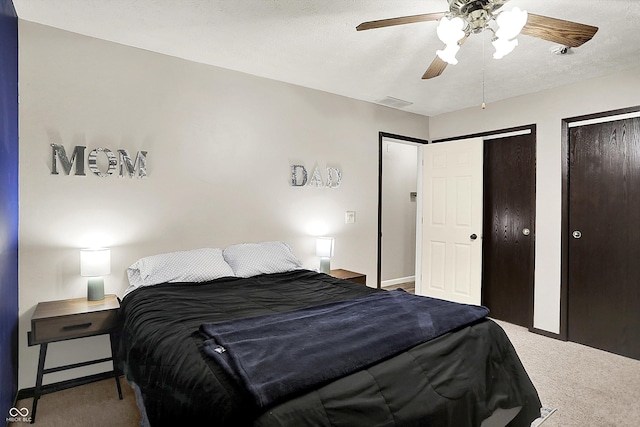 200 Forum Dr, Whiteland, IN 46184 - bedroom featuring carpet flooring, two closets, ceiling fan, and baseboards