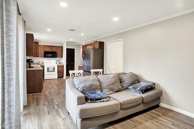 200 Forum Dr, Whiteland, IN 46184 - living room with baseboards, light wood-style floors, recessed lighting, and crown molding