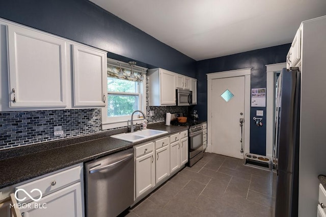 3934 N Kenwood Ave, Indianapolis, IN 46208 - kitchen featuring appliances with stainless steel finishes, a sink, and white cabinets