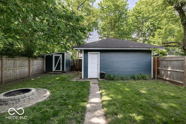 3934 N Kenwood Ave, Indianapolis, IN 46208 - view of shed with an outdoor fire pit