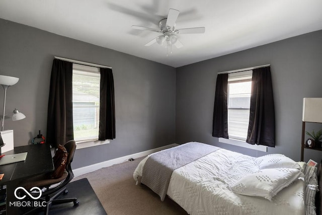 3934 N Kenwood Ave, Indianapolis, IN 46208 - carpeted bedroom featuring multiple windows, baseboards, ceiling fan, and an office area