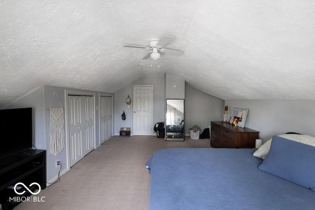 3934 N Kenwood Ave, Indianapolis, IN 46208 - carpeted bedroom with a textured ceiling, lofted ceiling, two closets, ceiling fan, and baseboards