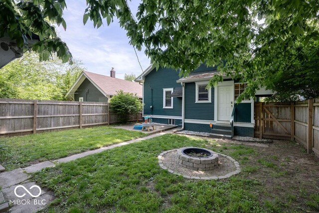 3934 N Kenwood Ave, Indianapolis, IN 46208 - back of house with a fire pit and entry steps