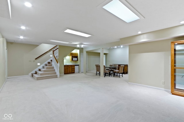 8723 Bergeson Dr, Indianapolis, IN 46278 - finished below grade area with recessed lighting, light colored carpet, baseboards, and stairs