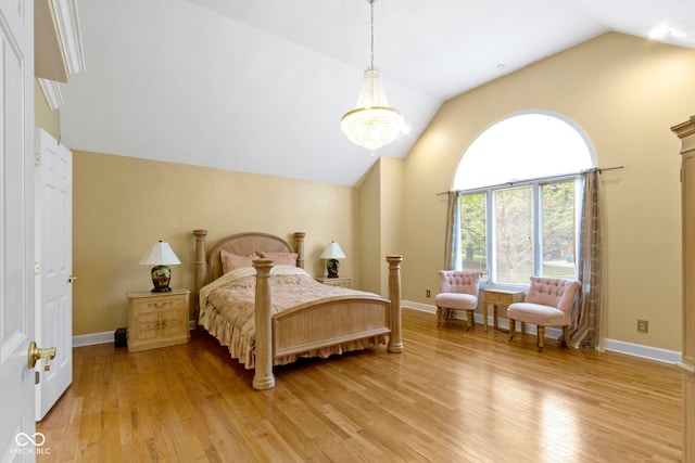 8723 Bergeson Dr, Indianapolis, IN 46278 - bedroom featuring vaulted ceiling, light wood-style flooring, a chandelier, and baseboards