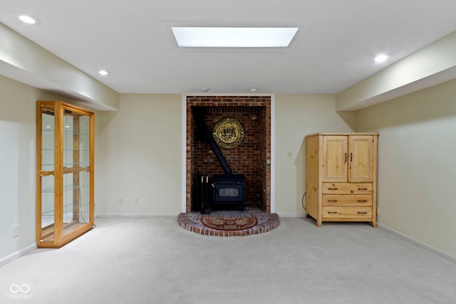 8723 Bergeson Dr, Indianapolis, IN 46278 - living room featuring a wood stove, light carpet, recessed lighting, and baseboards
