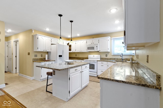 8723 Bergeson Dr, Indianapolis, IN 46278 - kitchen featuring white appliances, a sink, white cabinets, a kitchen island, and recessed lighting
