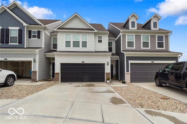 14350 Ludwell Ct, Fishers, IN 46037 - view of property with a garage, brick siding, and driveway