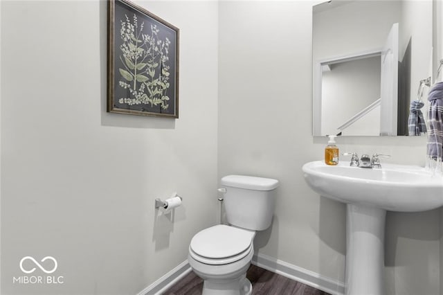 14350 Ludwell Ct, Fishers, IN 46037 - bathroom featuring toilet, wood finished floors, and baseboards