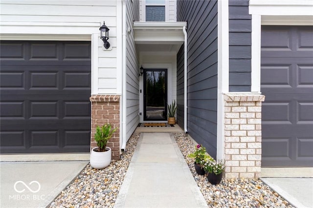 14350 Ludwell Ct, Fishers, IN 46037 - property entrance featuring a garage and brick siding