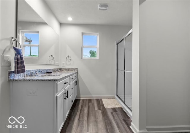14350 Ludwell Ct, Fishers, IN 46037 - full bath with a shower stall, wood finished floors, vanity, and plenty of natural light