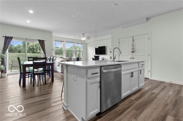 14350 Ludwell Ct, Fishers, IN 46037 - kitchen featuring dishwasher, a sink, dark wood-type flooring, light countertops, and an island with sink