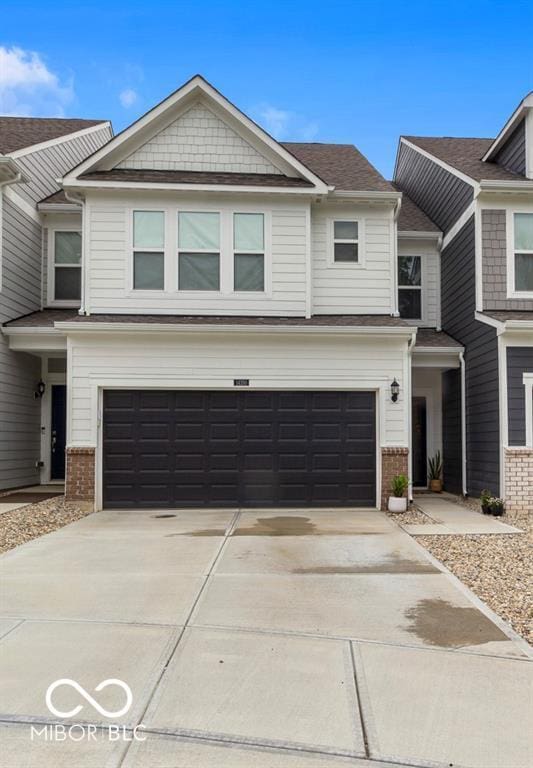 14350 Ludwell Ct, Fishers, IN 46037 - view of front of property with a garage, brick siding, and concrete driveway