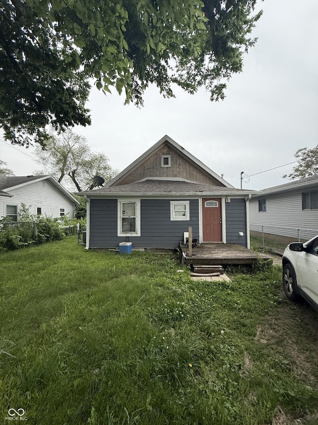 bungalow-style home with a wooden deck