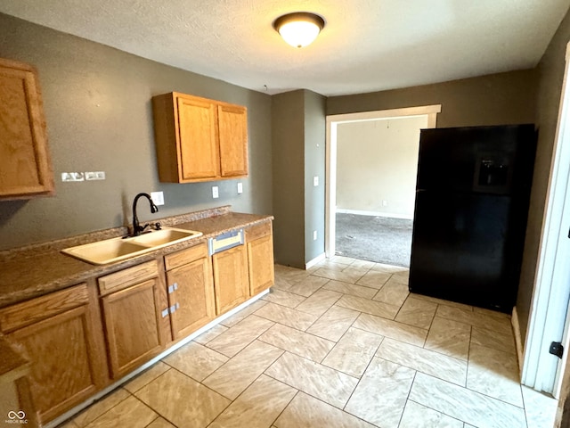 104 W Pearl St, Trafalgar, IN 46181 - kitchen with freestanding refrigerator, a sink, and baseboards